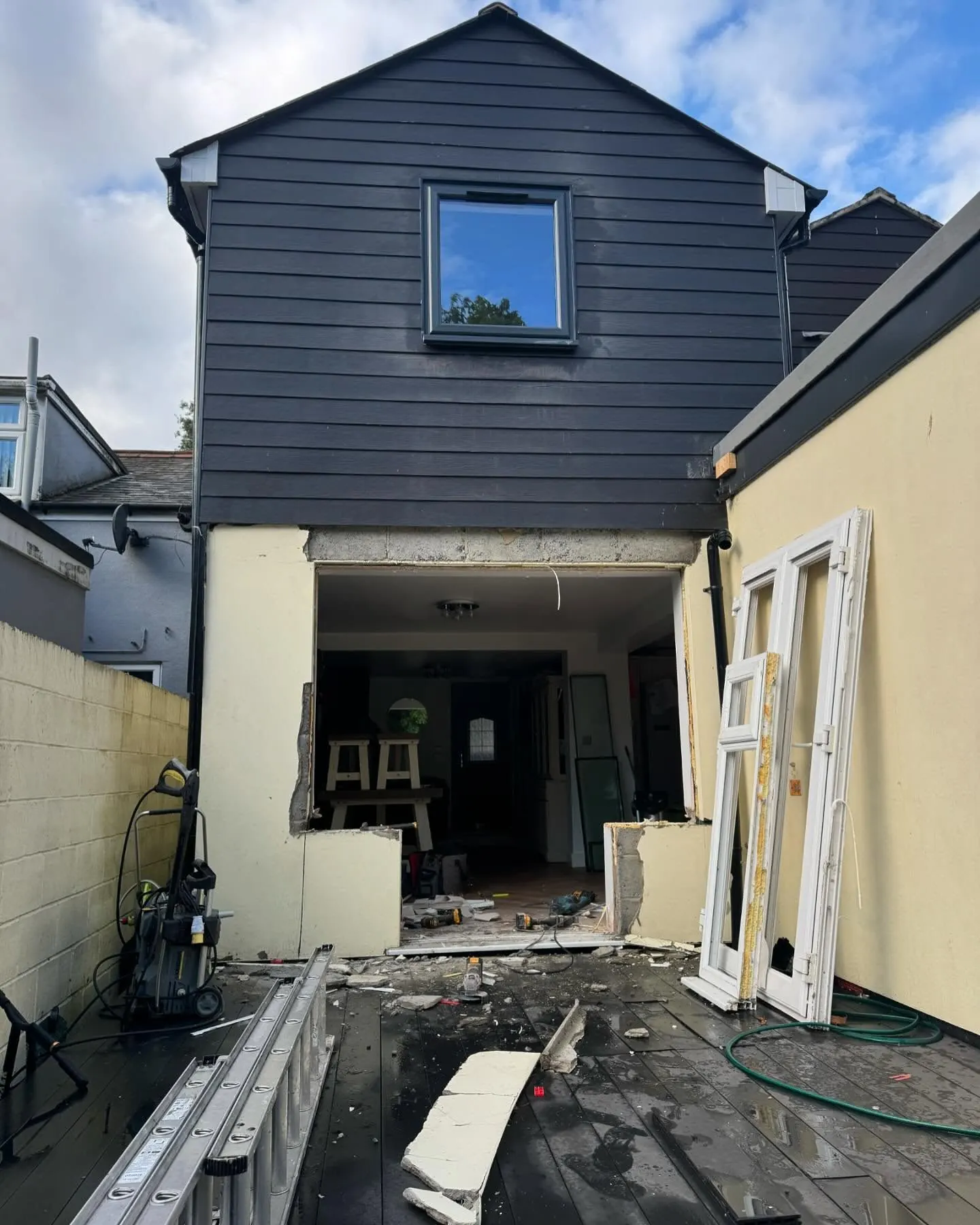 Rear wall opened up and the new two storey structure clad, mid build